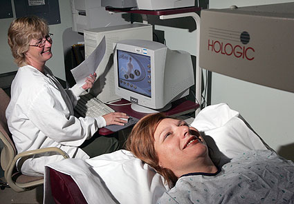 Woman laying down for a bone density scan